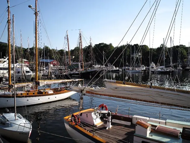 Sailing vessels on the sunny coastline of Rostock, accompanied by the shoreline, sea, and sky, made...