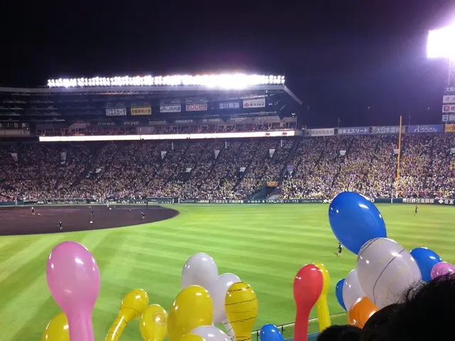 In this image there are few kids holding balloons in their hand. They are standing behind the...